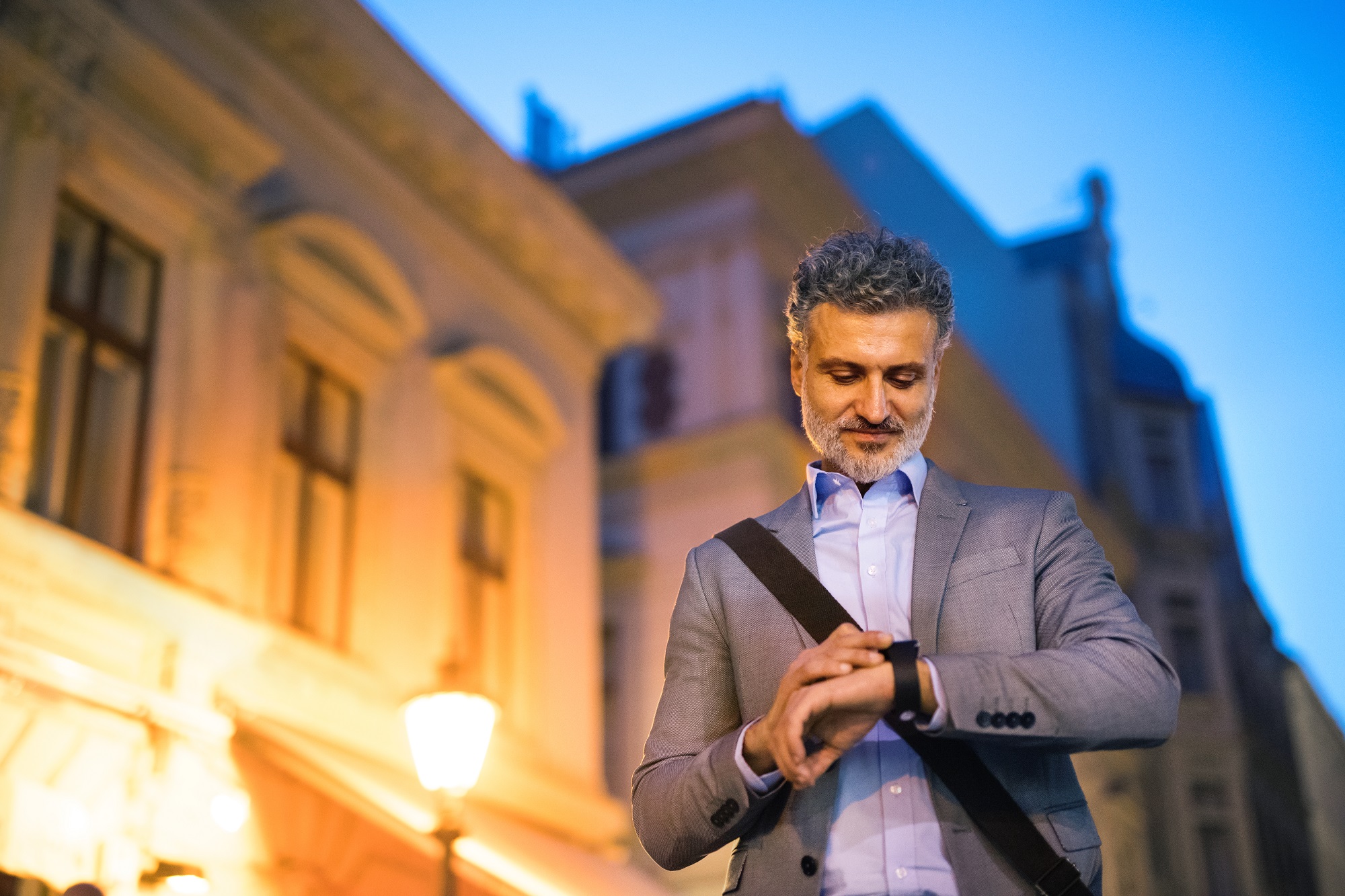 Mature businessman with a smartwatch.