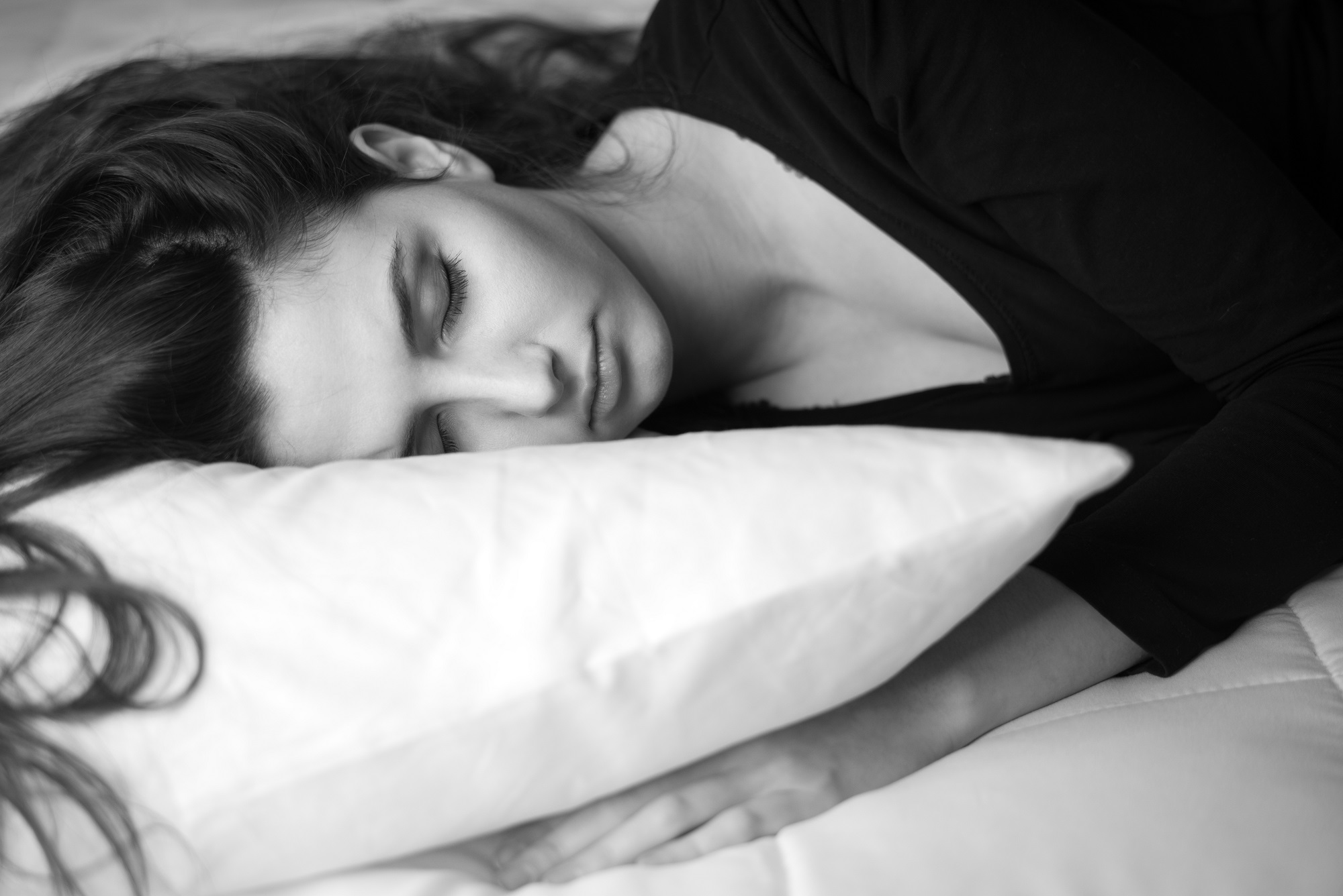 woman sleeping on the bed at home