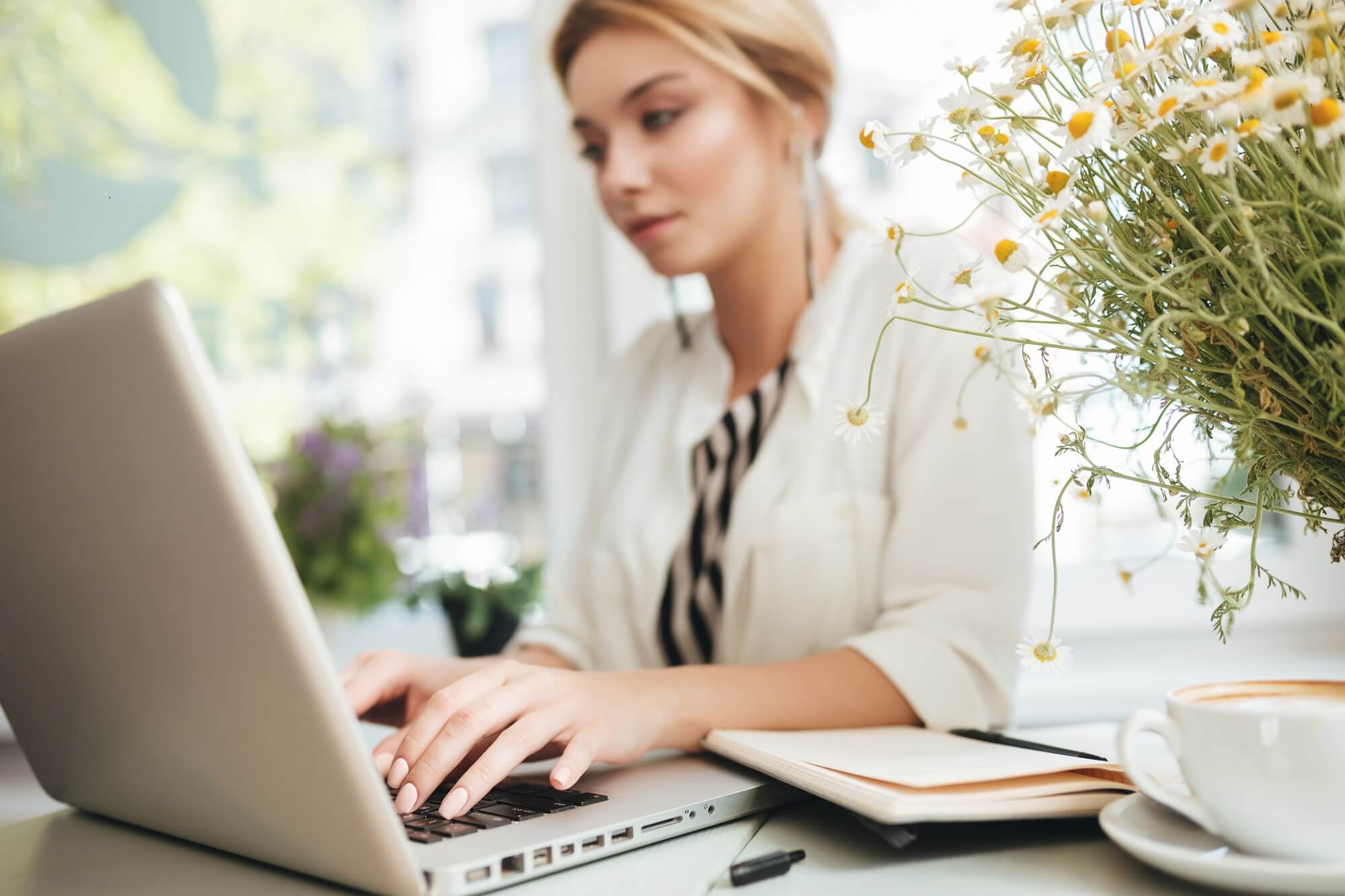 lady working on a laptop using PureVPN