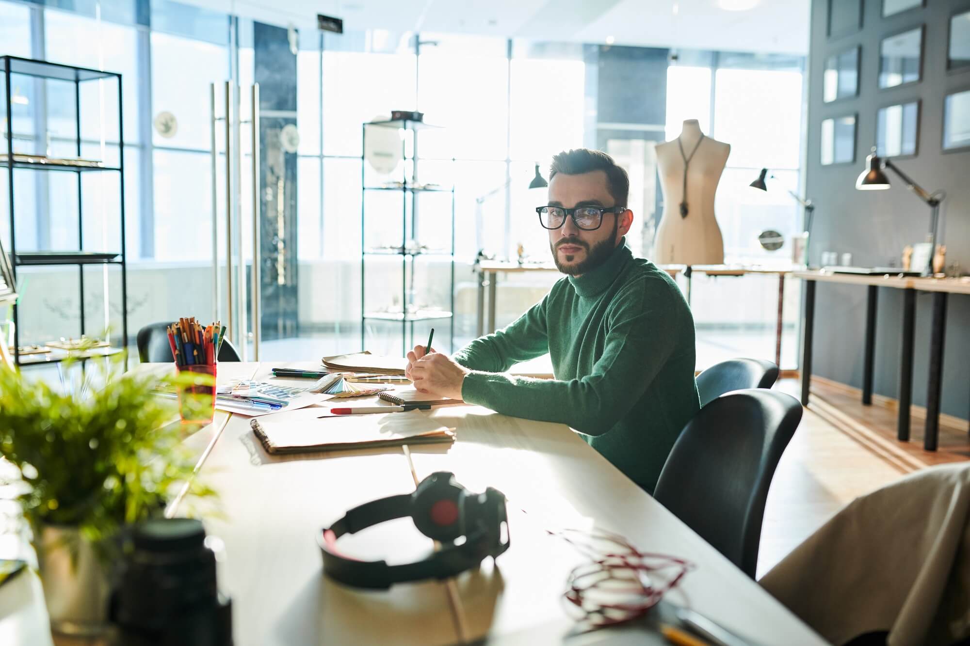  designer looking at camera while sitting about reinventing design