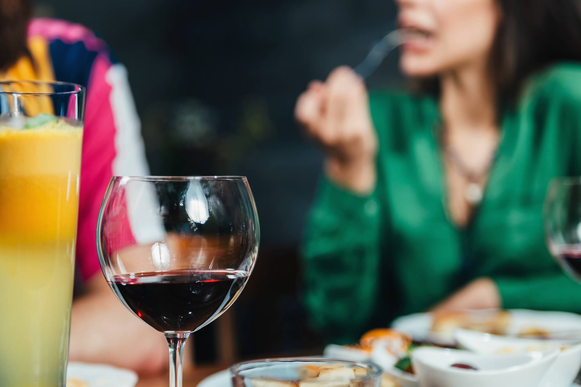 Young woman testing dinner served in restaurant. 