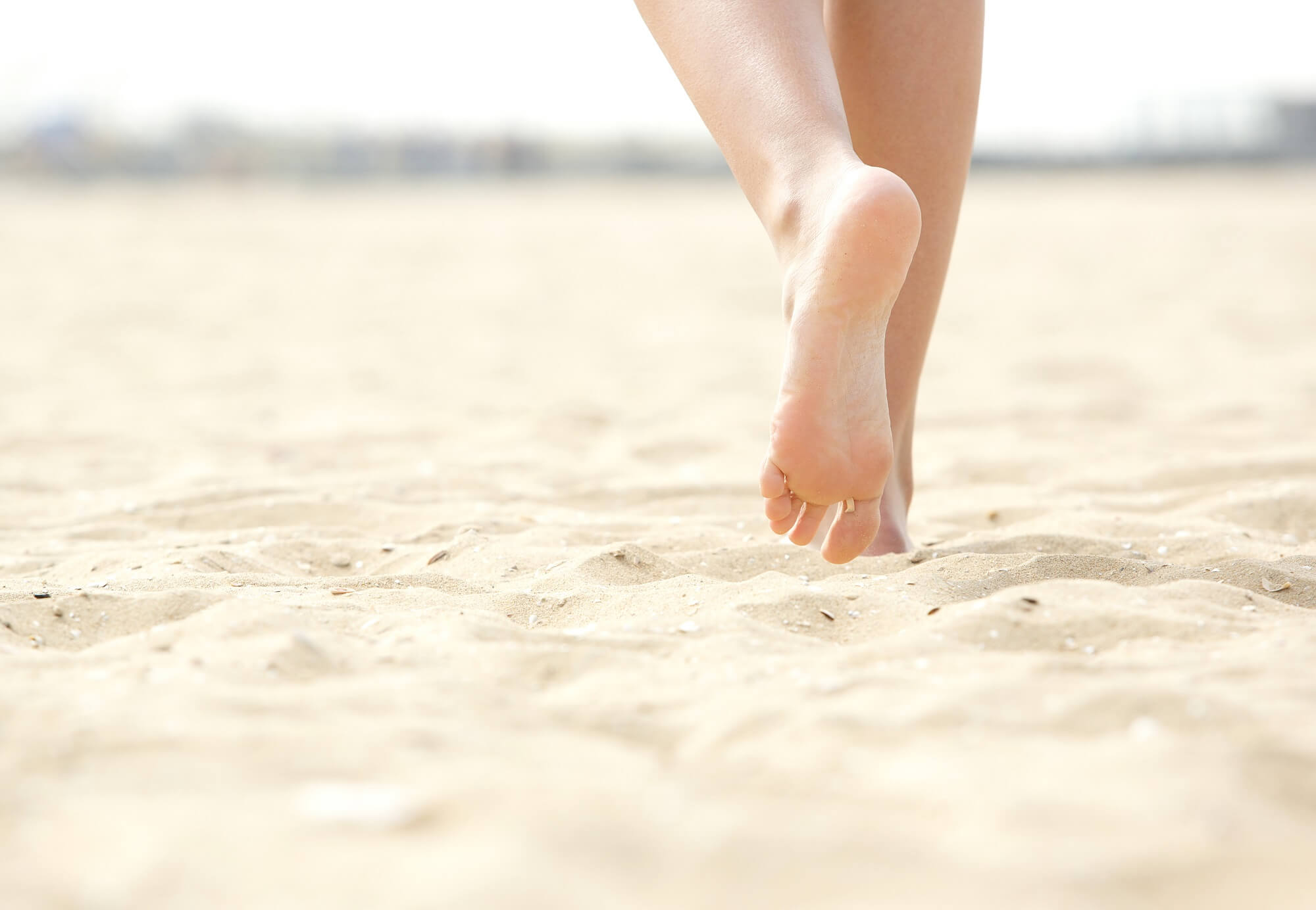 Woman working out on the beach