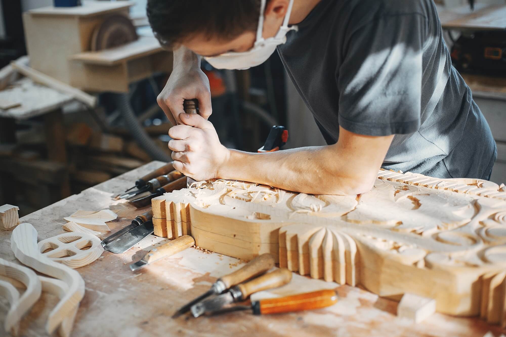 carpenter working on wooden crafts