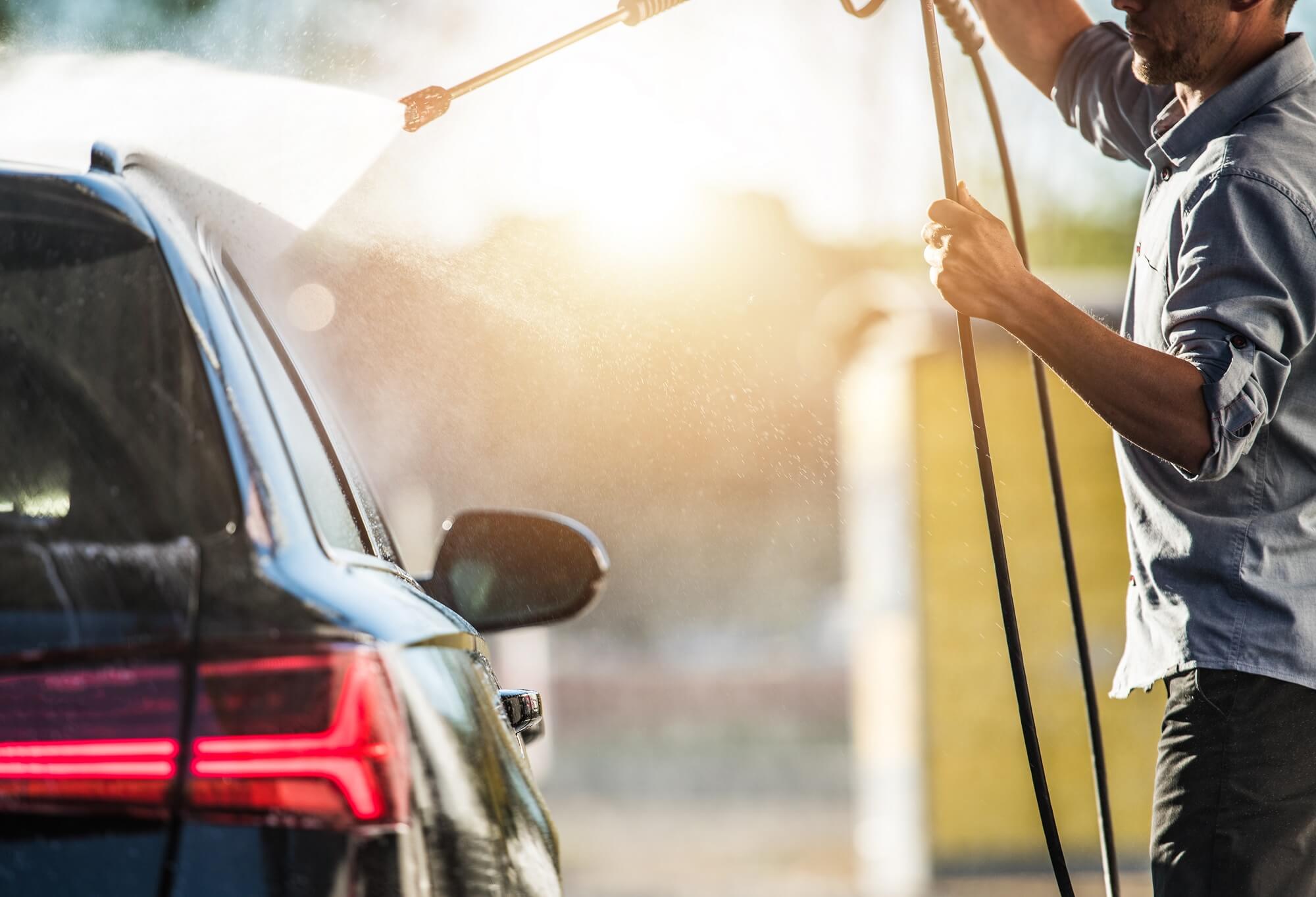 Car Wash Worker Cleaning Exterior