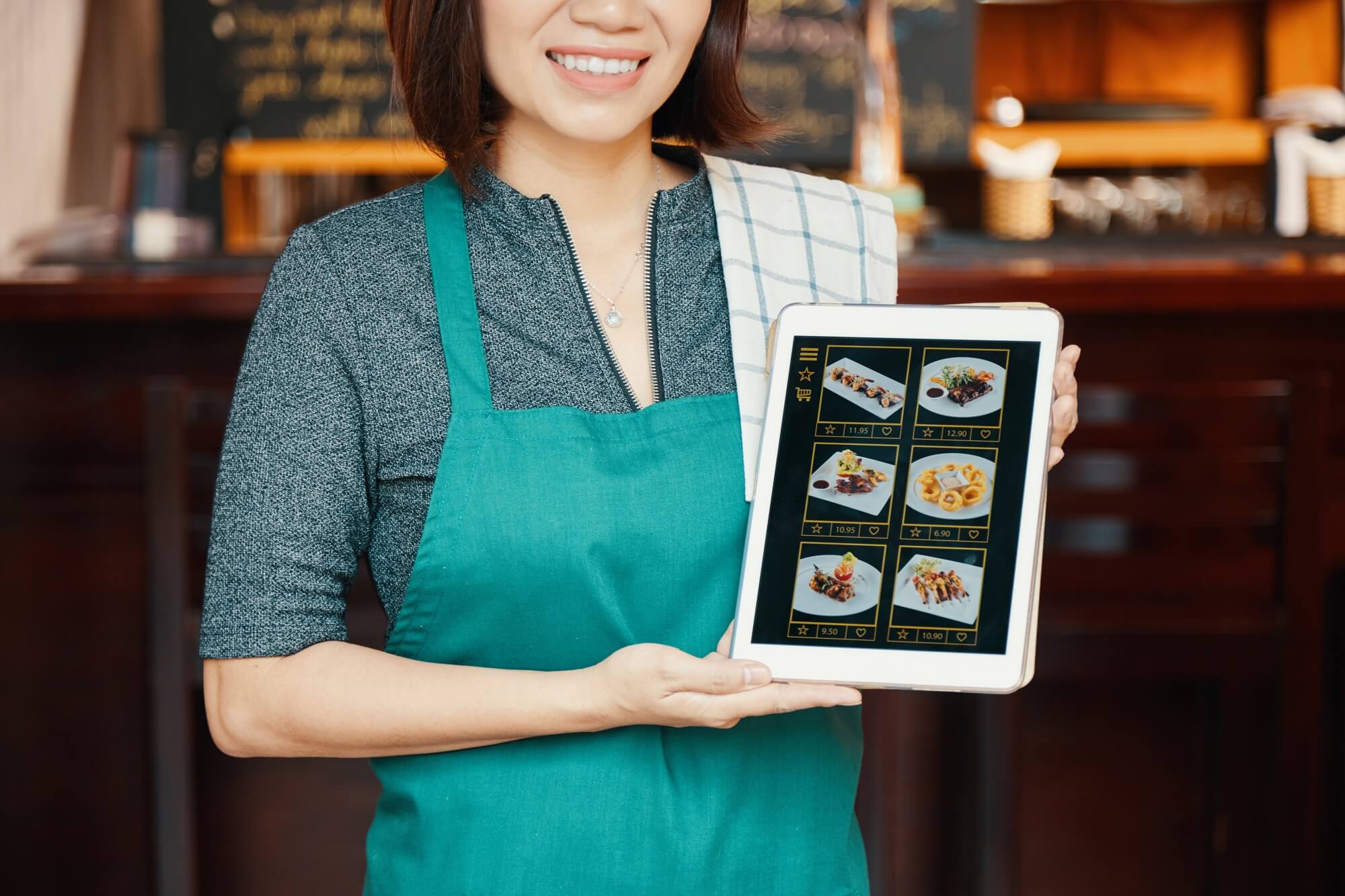 new menu on tablet computer shown by caterer