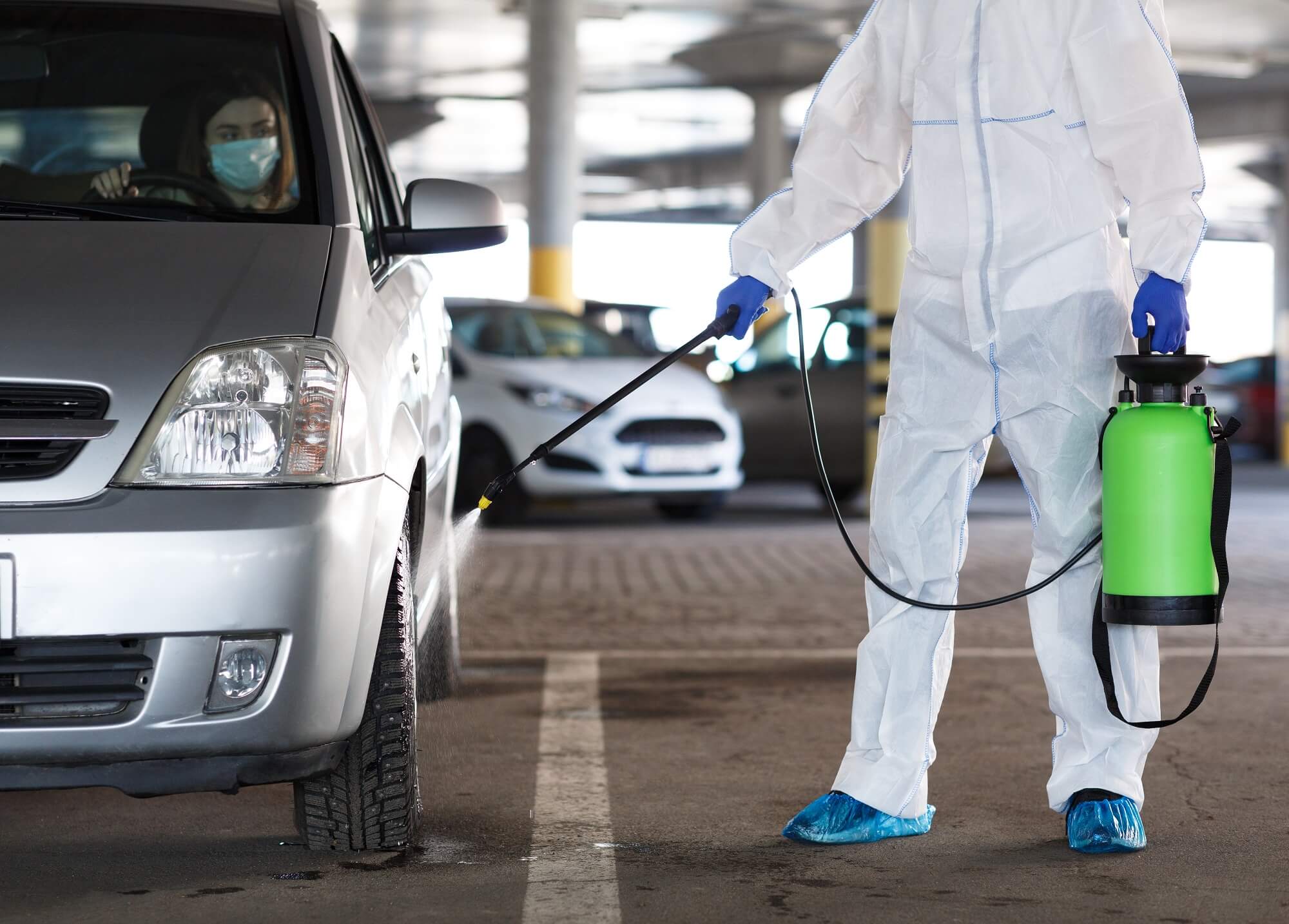 disinfecting car with spray