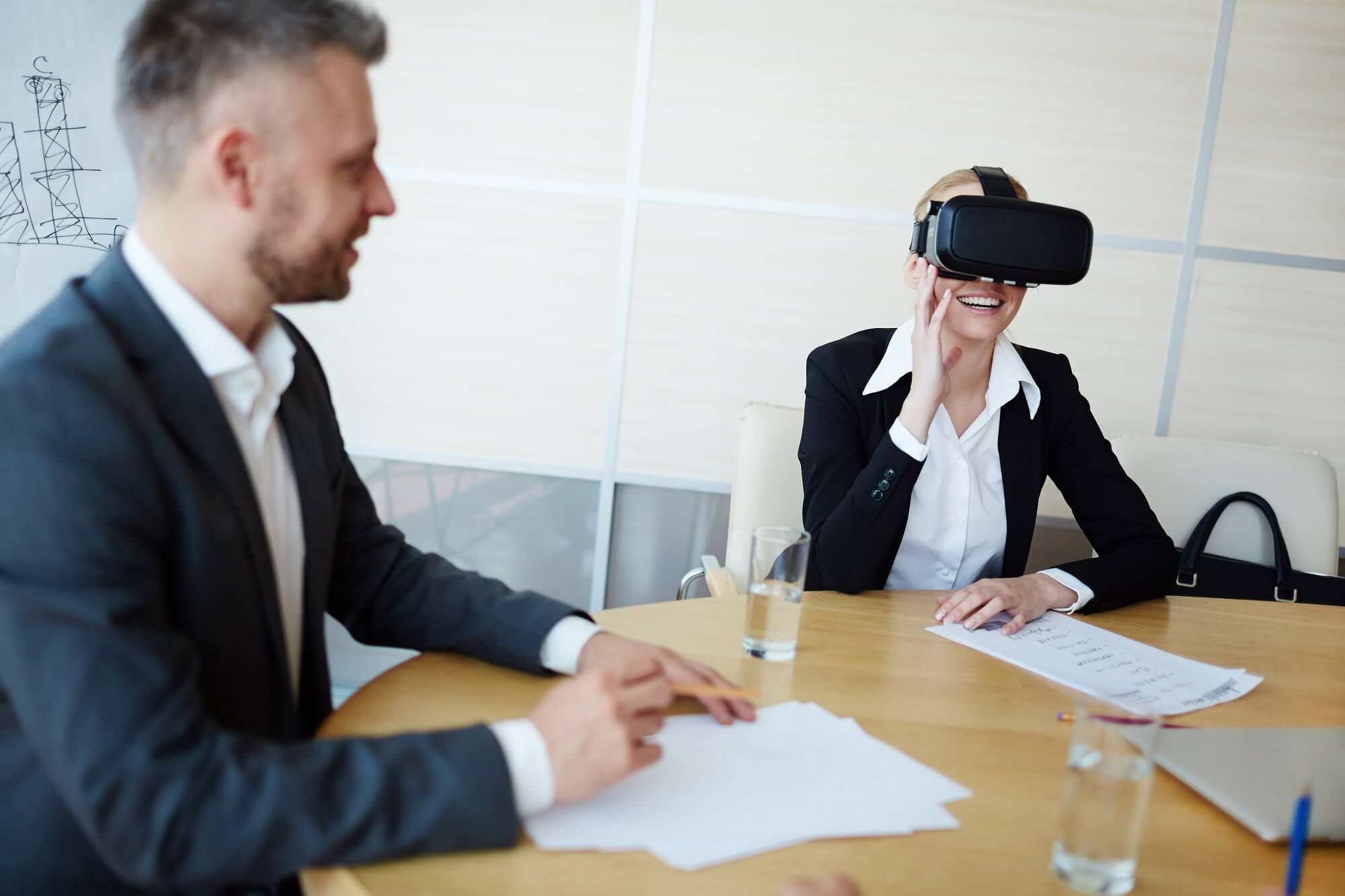 female client looking through corporate event with vr headset and doing virtual event planning