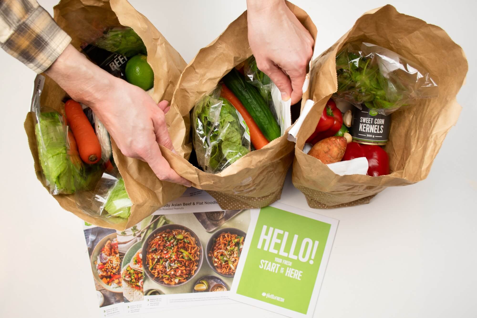 Hello Fresh meal kit raw ingredients in a paper bag