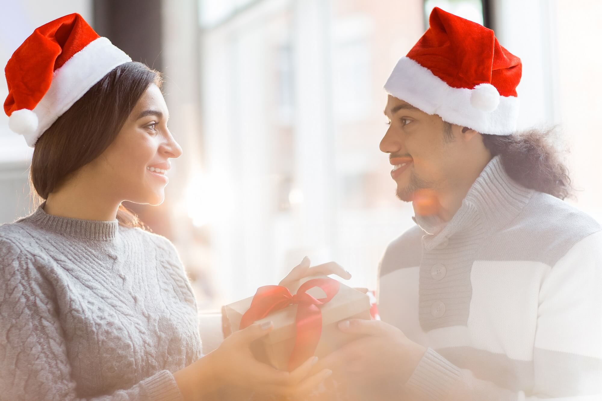  present in box looking at one another on Christmas eve