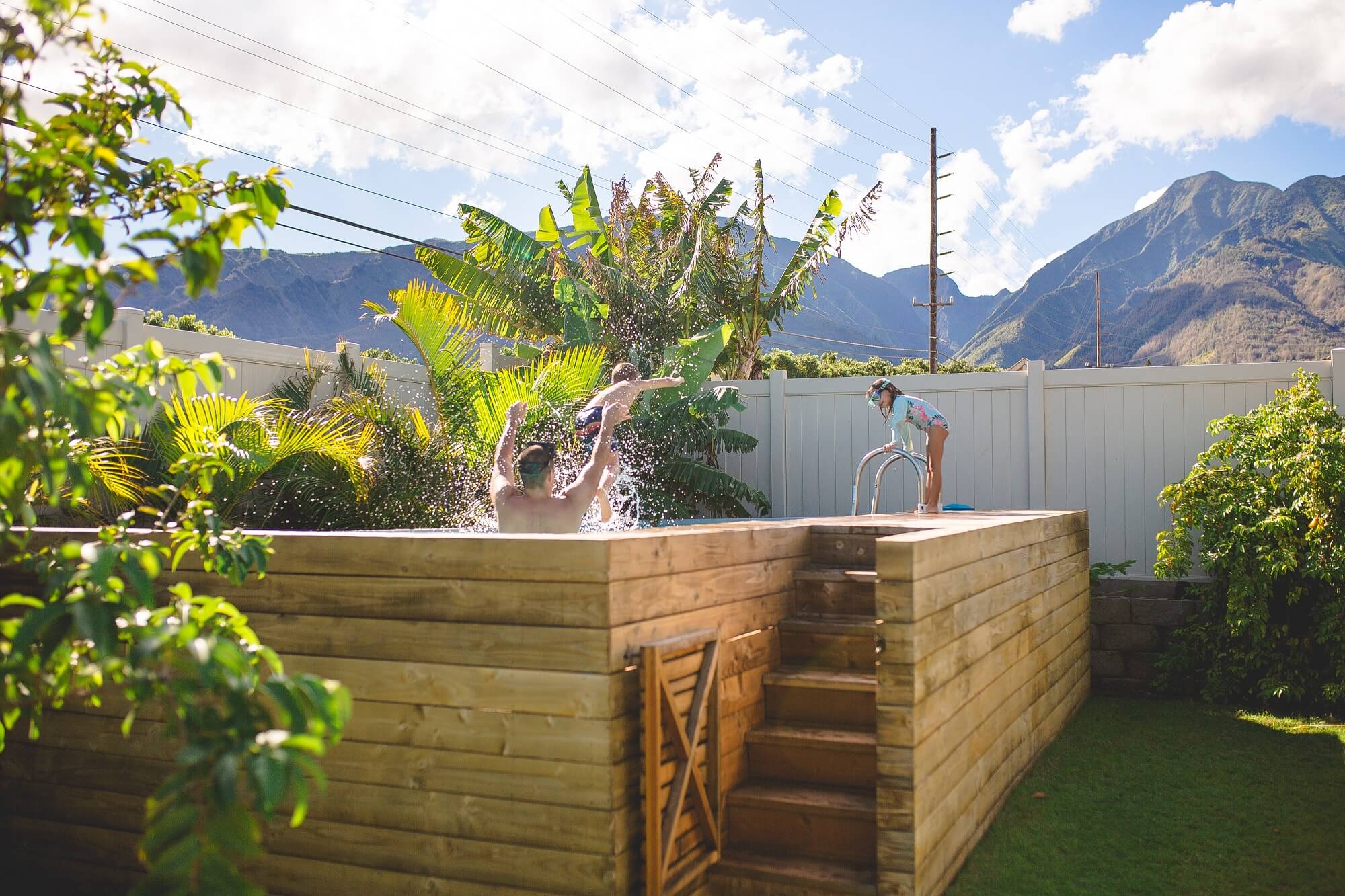 wooden above ground swimming pool with kids playing 