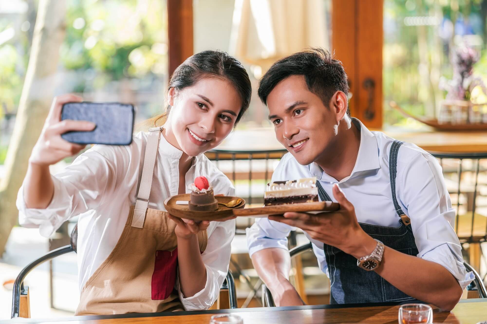 bakery owners taking picture for their social media 