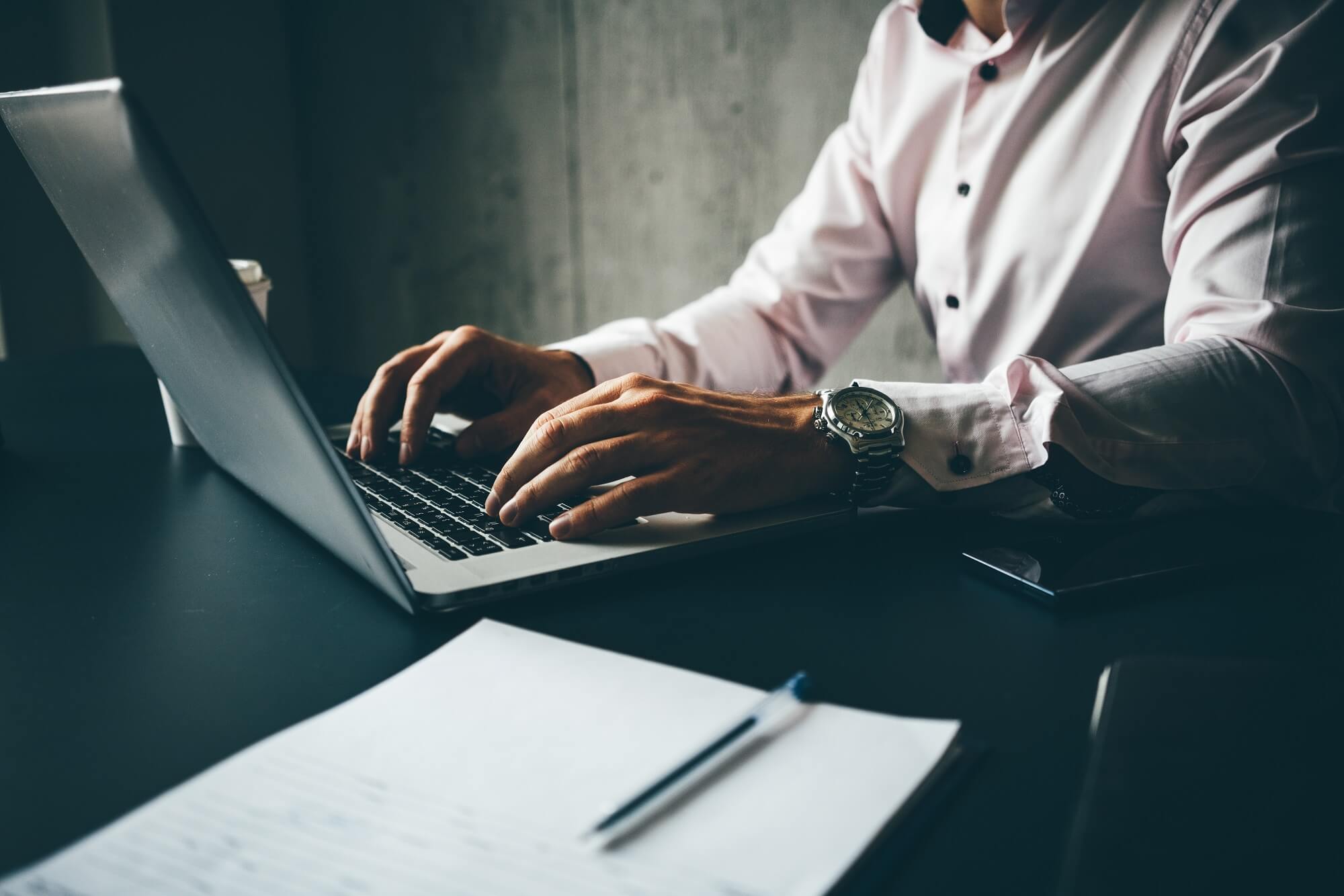 blogger working on his laptop for his business website